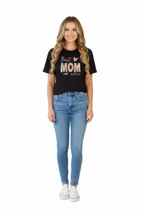 Black t-shirt with 'Best Mom ever' text worn by a person with long blonde hair.